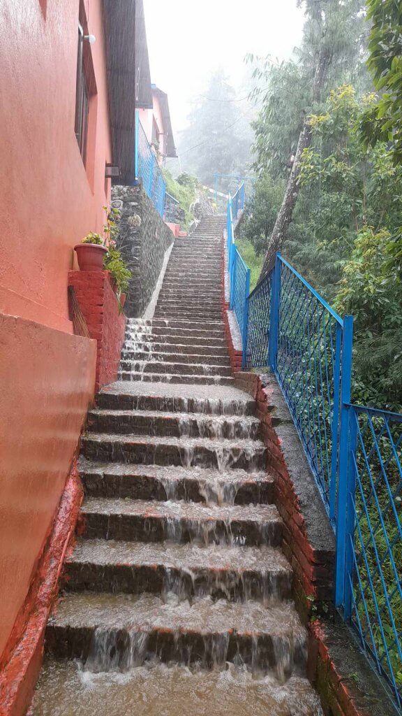 The view looking up at four flights of the steeply terraced school steps as the water cascades down.